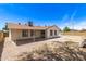 The home's backyard features a covered patio and a large gravel lot at 4832 W Golden Ln, Glendale, AZ 85302