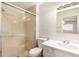 Updated bathroom featuring a glass enclosed shower, and a modern vanity with stylish faucet at 4832 W Golden Ln, Glendale, AZ 85302