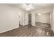 Neutral bedroom with mirrored closet, ceiling fan, and new laminate wood flooring at 4832 W Golden Ln, Glendale, AZ 85302