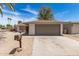 This single-story house features a two-car garage and well-maintained landscaping at 4832 W Golden Ln, Glendale, AZ 85302