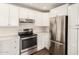 Beautiful kitchen featuring stainless steel appliances, white cabinets, and plenty of counter space at 4832 W Golden Ln, Glendale, AZ 85302