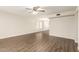 The living room showcases new laminate flooring and abundant natural light at 4832 W Golden Ln, Glendale, AZ 85302