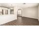 This spacious living room features laminate flooring and an open floorplan at 4832 W Golden Ln, Glendale, AZ 85302