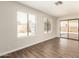 The living room has large windows and laminate flooring at 4832 W Golden Ln, Glendale, AZ 85302