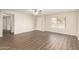 The large living room has laminate floors and leads to the front door at 4832 W Golden Ln, Glendale, AZ 85302
