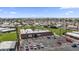 Aerial shot showcases a clubhouse, a pool, green spaces, and plenty of parking at 500 N 67Th Ave # 52, Phoenix, AZ 85043
