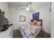 A lovely bedroom features a bed with colorful patterned bedding, a ceiling fan, and ample lighting at 500 N 67Th Ave # 52, Phoenix, AZ 85043