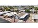 A charming manufactured home features a spacious carport and low maintenance desert landscaping at 500 N 67Th Ave # 52, Phoenix, AZ 85043