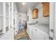 Convenient laundry area with washer, dryer, and storage shelves at 500 N 67Th Ave # 52, Phoenix, AZ 85043