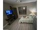 Bedroom featuring natural light and a cozy atmosphere with a ceiling fan at 546 E San Carlos Way, Chandler, AZ 85249