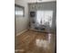 Sunlit dining area with a large window, stylish cabinet, and ceramic tile flooring at 546 E San Carlos Way, Chandler, AZ 85249