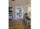 Hallway with light brown ceramic tile floor and archway into the living area at 546 E San Carlos Way, Chandler, AZ 85249