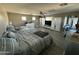 Large main bedroom with ample space, a ceiling fan, and multiple windows at 546 E San Carlos Way, Chandler, AZ 85249