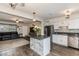 View of a kitchen with an island, stainless steel appliances, and open access to the living room at 5801 W Cortez St, Glendale, AZ 85304