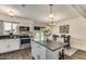 Bright kitchen featuring stainless appliances, center island, and an adjacent dining area for seamless entertaining at 5801 W Cortez St, Glendale, AZ 85304