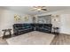 Spacious living room with wood floors, ceiling fan, and a comfortable sectional sofa, perfect for relaxation at 5801 W Cortez St, Glendale, AZ 85304