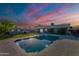 Sparkling pool surrounded by lush landscaping and a storage shed in the backyard at 5801 W Cortez St, Glendale, AZ 85304