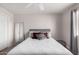 Cozy bedroom with a neutral palette, plush bedding, and a full-length mirror, offering a serene and stylish retreat at 5995 N 78Th St # 2004, Scottsdale, AZ 85250