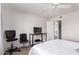 Bright bedroom featuring a desk and a peek into the attached bathroom, offering both work and convenience at 5995 N 78Th St # 2004, Scottsdale, AZ 85250