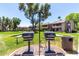 Community outdoor grilling area, set amongst lush landscaping, perfect for barbecues and neighborhood gatherings at 5995 N 78Th St # 2004, Scottsdale, AZ 85250