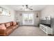Cozy living room with a plush sofa, large windows, and a contemporary entertainment center at 5995 N 78Th St # 2004, Scottsdale, AZ 85250