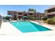 Sparkling community pool surrounded by lounge chairs and well-maintained landscaping, providing a relaxing outdoor space at 5995 N 78Th St # 2004, Scottsdale, AZ 85250