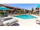 Inviting community pool with lounge chairs and umbrellas, offering a refreshing escape and social gathering space at 5995 N 78Th St # 2004, Scottsdale, AZ 85250
