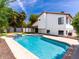 The backyard boasts a sparkling swimming pool, spa, and a well-maintained artificial grass area at 6154 E Karen Dr, Scottsdale, AZ 85254