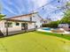The backyard features a swimming pool, fire pit, putting green and string lights at 6154 E Karen Dr, Scottsdale, AZ 85254