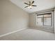 Bedroom with neutral walls, carpet flooring, a ceiling fan, and a window for ample natural light at 6154 E Karen Dr, Scottsdale, AZ 85254