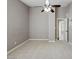 Neutral carpeted bedroom, featuring a ceiling fan and closet access, offering both comfort and storage at 6154 E Karen Dr, Scottsdale, AZ 85254
