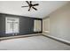 Spacious primary bedroom with ample natural light from two windows and carpet flooring at 6154 E Karen Dr, Scottsdale, AZ 85254