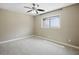 A bright bedroom featuring neutral carpet and a window providing natural light at 6154 E Karen Dr, Scottsdale, AZ 85254