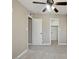 View of the carpeted bedroom with a ceiling fan and a closet space for storage at 6154 E Karen Dr, Scottsdale, AZ 85254