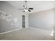 Neutral bedroom showcasing new carpet, modern ceiling fan, and closet space at 6154 E Karen Dr, Scottsdale, AZ 85254