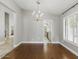 Bright dining room featuring a chandelier and hardwood flooring at 6154 E Karen Dr, Scottsdale, AZ 85254
