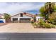 Charming home featuring a three car garage, beautiful landscaping, and desert plants in the front yard at 6154 E Karen Dr, Scottsdale, AZ 85254