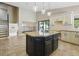 Open-concept kitchen with a large island, granite countertops, stainless steel appliances, and backyard access at 6154 E Karen Dr, Scottsdale, AZ 85254