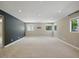 Spacious living room with neutral carpet, recessed lighting, and plenty of natural light from the windows at 6154 E Karen Dr, Scottsdale, AZ 85254