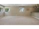 Spacious living room with neutral carpet, recessed lighting, and a wet bar at 6154 E Karen Dr, Scottsdale, AZ 85254