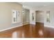 Spacious living room with hardwood floors and natural light from the window at 6154 E Karen Dr, Scottsdale, AZ 85254