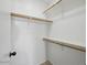 The walk-in closet boasts ample storage space with wooden rods and shelving at 6154 E Karen Dr, Scottsdale, AZ 85254