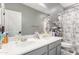 Functional bathroom with a double sink vanity, well-organized storage, and a shower-tub combination at 6204 W Hedgehog Pl, Phoenix, AZ 85083
