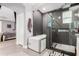 Elegant bathroom featuring a modern soaking tub, walk-in shower with glass enclosure, and high-end finishes at 6204 W Hedgehog Pl, Phoenix, AZ 85083