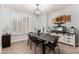 Bright dining room with modern decor and elegant chandelier lighting at 6204 W Hedgehog Pl, Phoenix, AZ 85083