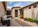 An exterior walkway featuring a seating area with a view of the front door at 6204 W Hedgehog Pl, Phoenix, AZ 85083