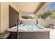 Relaxing covered hot tub with jets, offering a private spa experience with backyard views at 6204 W Hedgehog Pl, Phoenix, AZ 85083