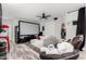Spacious living room with a large screen, plush seating, and a fun, casual atmosphere at 6204 W Hedgehog Pl, Phoenix, AZ 85083