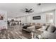 Large living room with a comfortable sectional sofa and modern furnishings at 6204 W Hedgehog Pl, Phoenix, AZ 85083