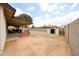 A covered patio and storage shed accent the desert-landscaped backyard at 6313 W Paradise Ln, Glendale, AZ 85306